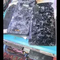 گوشی سوخته و شکسته و آب خورده