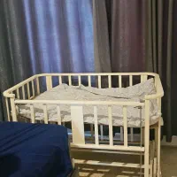 گهواره کنار تخت مادر