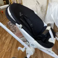 کالسکه مکسی کوزی کویینی لاکچری سه چرخ سفید مشکی