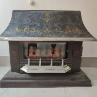 بخاری گازی و میز تلویزیون