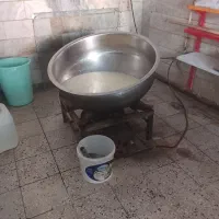 دیگ استیل و اجاق گاز