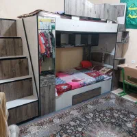 تخت خواب دوطبقه باکلی کشو کتابخانه