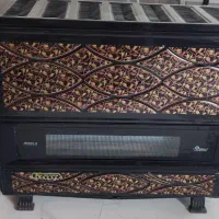 دوعدد بخاری ایران شرق و چرخ خیاطی