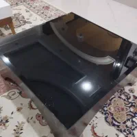 میز چوبی مشکی شیشه دودی