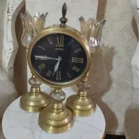 ساعت و شمعدان برنزی