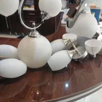 دوتا لوستر تکی و اتاق خواب و پایه های دیواری