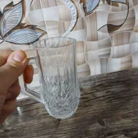 دودست استکان چای