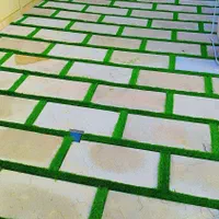 چمن مصنوعی نواری بین سنگی و بین ژوئن برش خورده