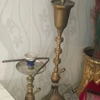 دوعدد قلیان برنجی ویک‌عدد اسپیکر