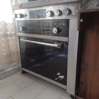 اجاق گاز پنج شعله صفحه شیشه شکسته
