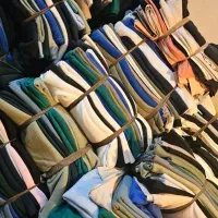 پارچه تریکو و نساجی طاقه و تیکه پارچه خریداریم