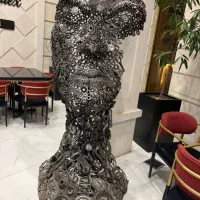 مجسمه صورت باقطعات ماشین