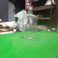 بطری شیشه ای و ظرف دیزی