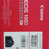 دوربین canon d100 به همراه کوله و  لنز و محافظ لنز