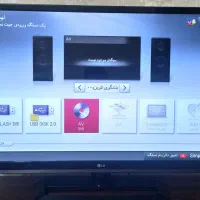 تلویزیون + سیستم صوتی تصویری همراه + میز