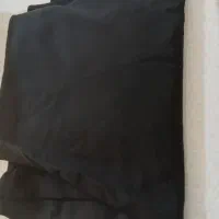 یه قواره چادر مشکی دوخته شده