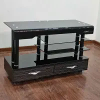 میز تلویزیون تمام شیشه‌ای