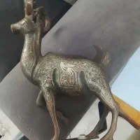 مجسمه نقره کوب
