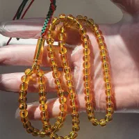 تسبیح سندلوس 101دانه زرد تراش کروی شمش شفاف آبدار
