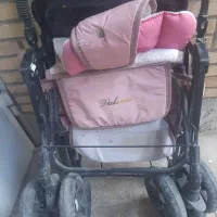 کالسکه صورتی  ، دو مدل  میز  کودک  و  دراور