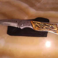 چاقو ضامن داره دسته طرح استخوانی