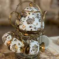 ست قوری و فنجان سرامیکی طرح گل طلایی