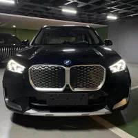 بی‌ام‌و ix1 مدل 2025/ کربن بلک - داخل قرمز