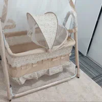 گهواره نوزاد به همراه پشه بند