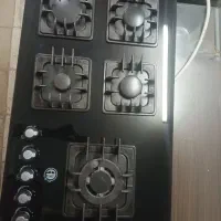 گاز پلوپز کنار روی میزی ۵ شعله درحدنو