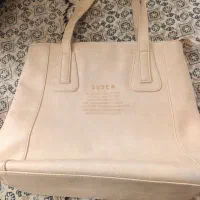 کیف شیری رنگ به علت لازم میفروشم