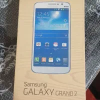 گوشی سامسونگ گراند2پشت چرم طلایی تمیز