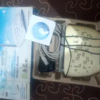 دو عدد مودم و چراغ مطالعه