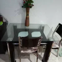 میز شیشه ای دوطبقه و صندلی