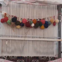 قالی دست بافت نیمه کاره با دار فلزی