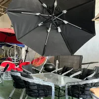 چتر پایه کنار میزو صندلی باغی سایبان لینوم اتشدان