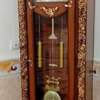 اینه کنسول و ساعت ایستاده و میز تلفن