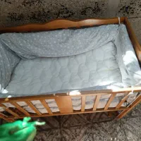 گهواره کنار تخت مادر