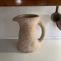 شمع و جعبه فنجان کادویی و کوسن و شال مبل