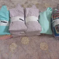 تعداد ی پیراهن مردانه وپسرانه