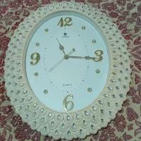 ساعت دیواری طرح صدف تمیزوسالم