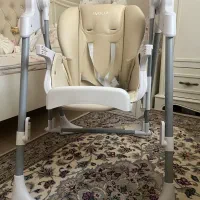 صندلی غذا کودک و تاب برقی موزیکال