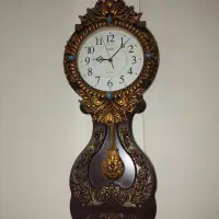 ساعت دیواری نو + یک عدد تندیس