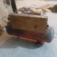 پمپ باد ۲۰۰ لیتری سالم  کم کار با شلنگ چند متری