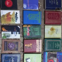 چهارده جلد کتاب به همراه هدیه
