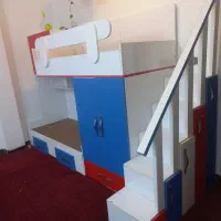 تخت دو طبقه کودک با کشو و کمد