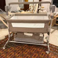 گهواره کنار مادر برقی