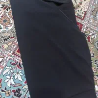 یک قواره چادر مشکی دوخته شده کار کرد
