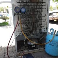 تعمیر یخچال فریزر و شارژ گاز دو میلیون تومان