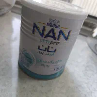 قوطی شیر خشک و ظرف نگهدارنده