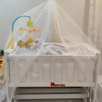 گهواره و تخت کناره مادر